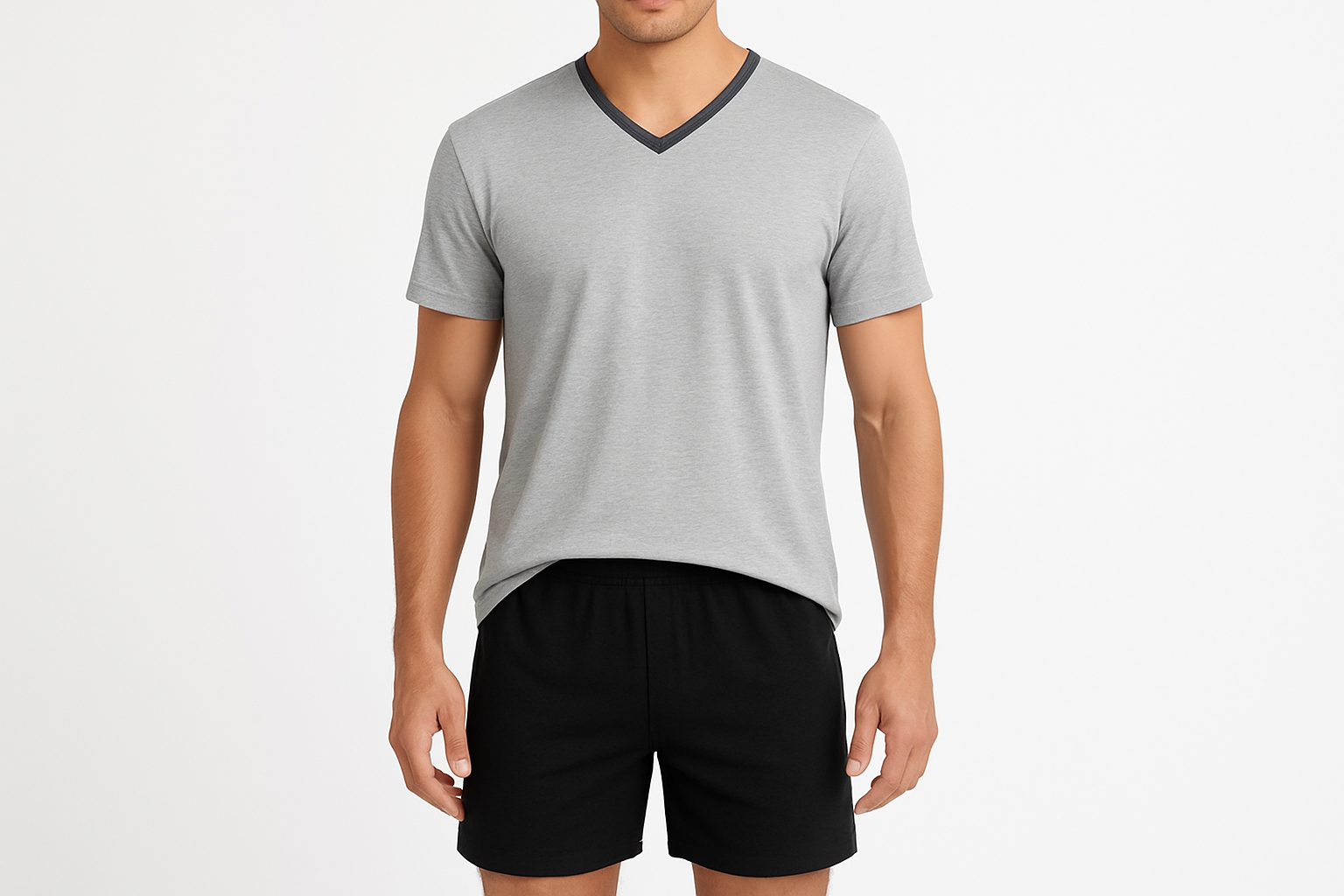 pijama para hombre con cuello en V y mangas y short cortos, en color Gris Melange claro el top con un vivo en color en el cuello y short color negro está diseñado para ofrecer comodidad durante el verano. Su tela fresca facilita la ventilación, manteniendo el cuerpo cómodo y seco. El calce ergonómico asegura libertad de movimiento, ideal para el descanso nocturno o momentos de relax en casa. Disponible en tallas grandes para adaptarse a diversas necesidades.